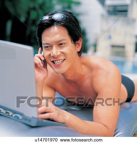 Stock Image - Close-Up, On the Phone, Toothy Smile, Summer, Vacations, One Person. Fotosearch