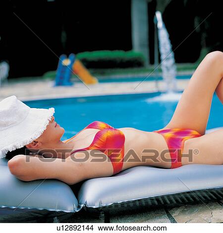 Folded, Close-Up, Focus On Foreground, Young Adult, Hands Behind Head, Water View Large Photo Image Picture - Folded, Close-Up, Focus On Foreground, Young Adult, Hands Behind Head, Water. Fotosearch