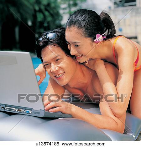 Stock Photography - Happiness, Wireless Technology, Outdoor, Looking Down, Day. Fotosearch