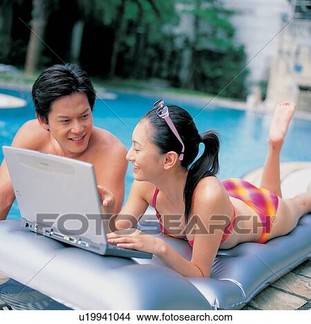 Picture - Poolside, Young Adult, Day, Talking, Outdoor, Close-Up. Fotosearch