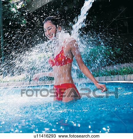 Stock Image - Shower, Youth Culture, Cheerful, Leisure Activity, Water, Swimsuit, Asian Ethnicity. Fotosearch