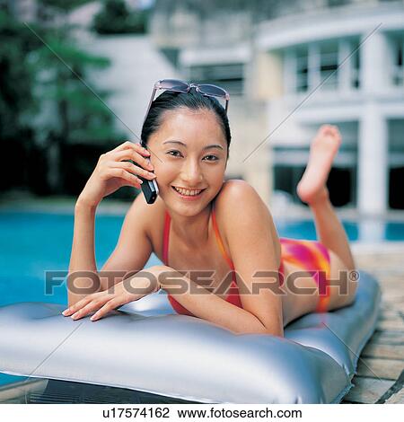 Smiling, Happiness, Mobile Phone, Barefoot, Black Hair, Asian Ethnicity, Water View Large Photo Image Stock Image - Smiling, Happiness, Mobile Phone, Barefoot, Black Hair, Asian Ethnicity, Water. Fotosearch