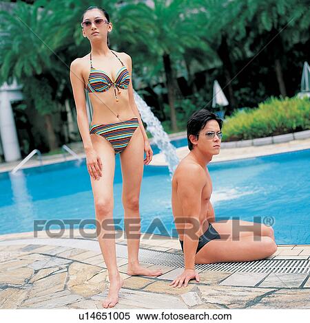 Summer Vacation, Day, Young Men, Palm Tree, Swimming Trunks, Black Hair View Large Photo Image Stock Photography - Summer Vacation, Day, Young Men, Palm Tree, Swimming Trunks, Black Hair. Fotosearch