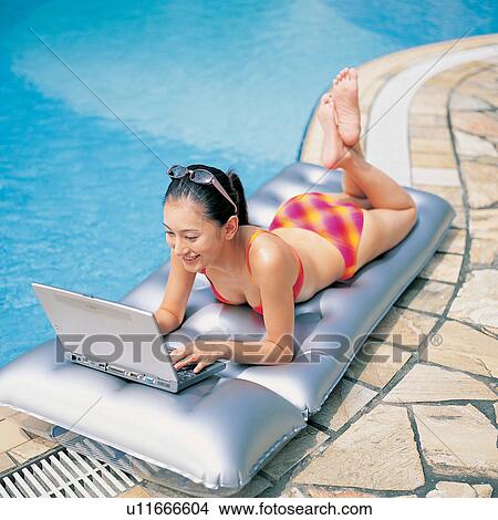 Picture - Sunglasses, Looking, At The Edge Of, Leaning, Laptop, Black Hair. Fotosearch