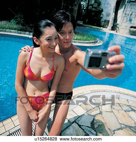 Stock Photo - Swimming Pool, Summer Vacation, Swimsuit, Outdoor, Summer, Smiling. Fotosearch