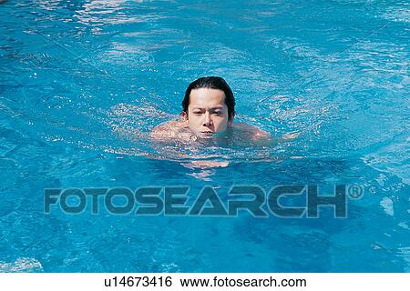 Vacations, Tourist Resort, Blue, One Young Man Only, Water, Leisure Activity View Large Photo Image Stock Photograph - Vacations, Tourist Resort, Blue, One Young Man Only, Water, Leisure Activity. Fotosearch