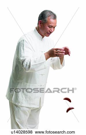 Stock Photo - Asian Ethnicity, Close-Up, Casual Clothing, Cake, Active. Fotosearch