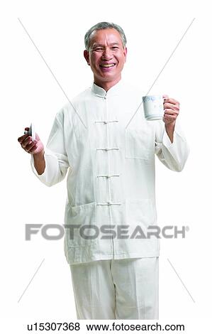 Stock Photo - Looking At Camera, One Person, Refreshment, Indoor, Standing. Fotosearch