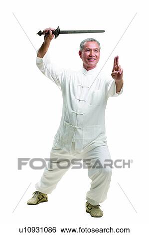 Tai-Chi Active, Active, One Person, Holding, Casual Clothing View Large Photo Image Stock Photograph - Tai-Chi Active, Active, One Person, Holding, Casual Clothing. Fotosearch