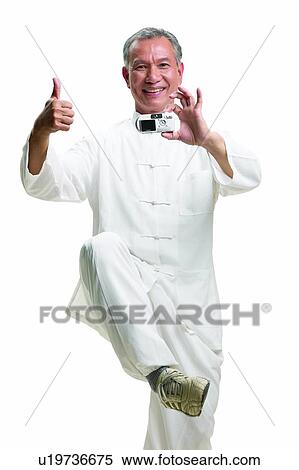 Tai-Chi, Korean Ethnicity, Toothy Smile, Hand Sign, Looking At Camera View Large Photo Image Stock Photography - Tai-Chi, Korean Ethnicity, Toothy Smile, Hand Sign, Looking At Camera. Fotosearch