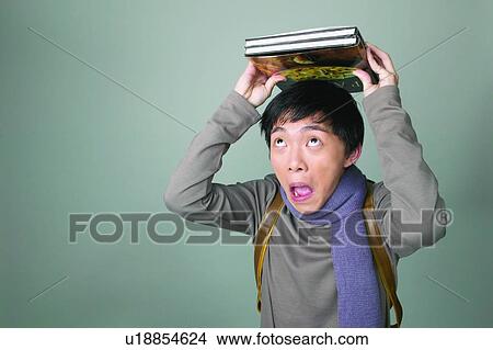 Picture - Book, Adolescence, Black Hair, Backpack, Asian Ethnicity, Casual Clothing, 16-17 Years. Fotosearch