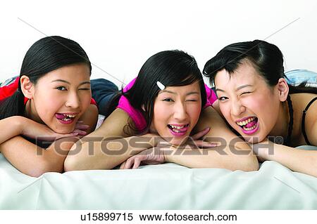 Stock Photography - Braids, Adolescence, Black Hair, Bed, Asian Ethnicity, Casual Clothing, 16-17 Years. Fotosearch