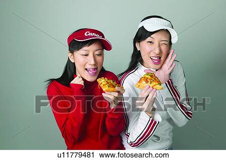 Stock Image - Casual Clothing, Adolescence, Cap, Black Hair, Asian Ethnicity, Close-Up, 16-17 Years. Fotosearch