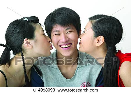 Stock Image - Casual Clothing, Three People, Teenage Boys, Togetherness, Front View Asian Ethnicity, Tank Top. Fotosearch