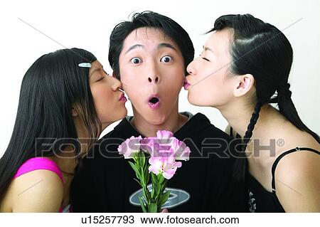 Stock Image - Head And Shoulders, Flower, Casual Clothing, Holding, Teenage Boys, Teenager. Fotosearch