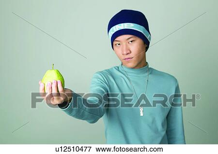 Healthy Food, Holding, Standing, Asian, Teenager View Large Photo Image Stock Photo - Healthy Food, Holding, Standing, Asian, Teenager. Fotosearch