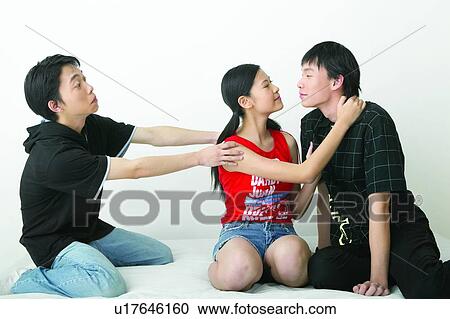 Stock Image - Long Hair, Adolescence, Black Hair, Jeans, Teenagers Only. Fotosearch