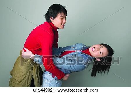 Looking At Camera, Portrait, Happiness, Two People, Colored Background, Denim Jacket View Large Photo Image Stock Image - Looking At Camera, Portrait, Happiness, Two People, Colored Background, Denim Jacket. Fotosearch