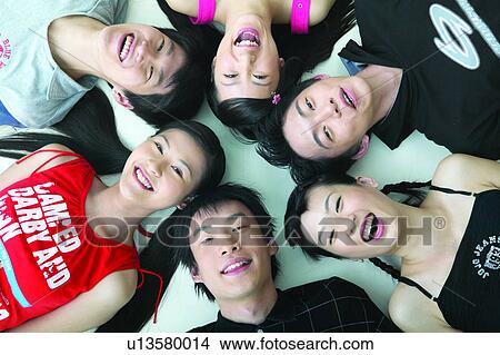 Picture - Looking At Camera, Toothy Smile, Group Of People, Asian, Teenage Boys, Smiling. Fotosearch