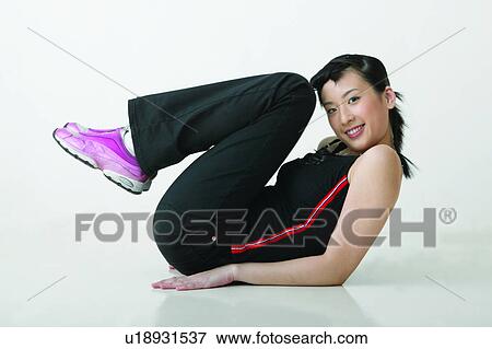 Stock Photo - Toothy Smile, Lifestyles, One Teenage Girl Only, Indoor Adolescence, Casual Clothing, Braids. Fotosearch