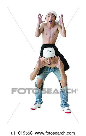Stock Photo - Bending, Asian Ethnicity, Male Bonding, Torn, Making A Face, Portrait. Fotosearch