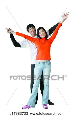 Stock Image - Black Hair, 16-17 Years, Asian Ethnicity, Arm Outstretched, Adolescence, Casual Clothing, 14-15 Years. Fotosearch