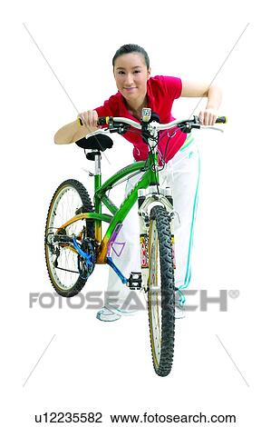 Stock Image - Black Hair, Adolescence, Bicycle, Bending, Asian Ethnicity, Casual Clothing, 16-17 Years. Fotosearch