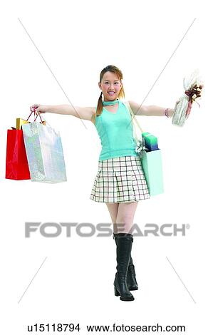 Picture - Brown Hair, Adolescence, Boot, Asian Ethnicity, Arm Outstretched, Carrying, 14-15 Years. Fotosearch