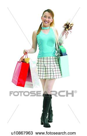 Stock Image - Carrying, Adolescence, Brown Hair, Boot, Asian Ethnicity, Clipping Path, 14-15 Years. Fotosearch
