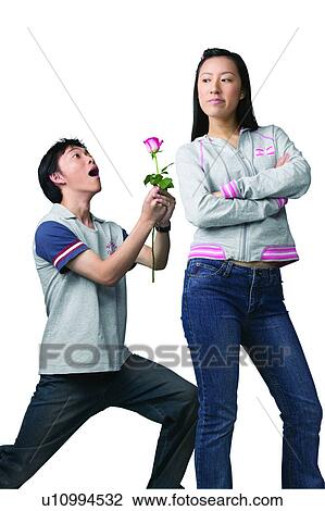 Stock Image - Indoor, Arms Crossed, Teenage Boys, Teenagers Only, Cut Out, Standing. Fotosearch