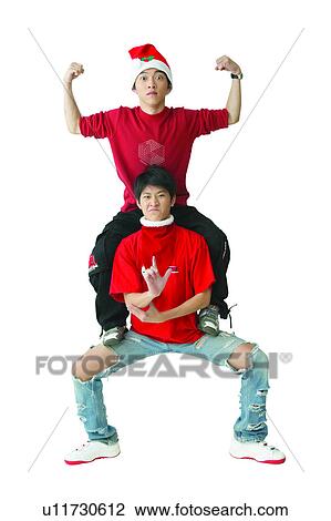 Stock Image - Making A Face, Shoe, Teenagers, White Background, Jeans, Teenage Boys. Fotosearch