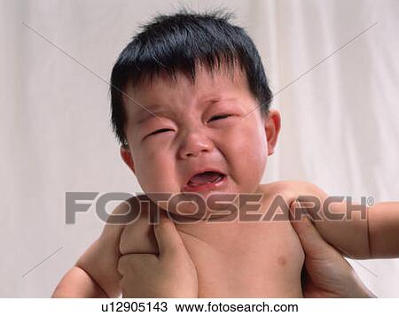 Baby boy is lifted, crying, portrait, front view View Large Photo Image Stock Image - Baby boy is lifted, crying, portrait, front view. Fotosearch