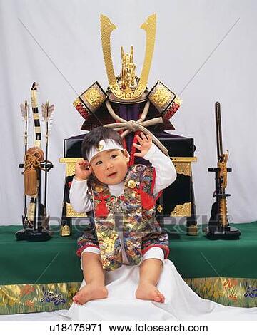 Baby boy smiling, wearing costume, background war helmet and swords, front view, portrait View Large Photo Image Stock Image - Baby boy smiling, wearing costume, background war helmet and swords, front view, portrait. Fotosearch