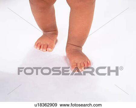 Baby's feet, high angle view View Large Photo Image Stock Photo - Baby's feet, high angle view . Fotosearch