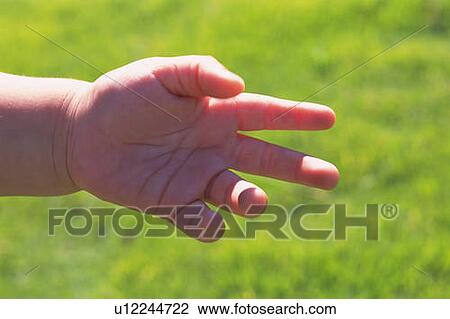 Stock Image - Close up baby's left hand, front view . Fotosearch