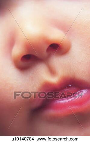 Picture - Close up of baby's face, high angle view, Full Frame . Fotosearch