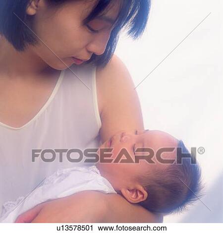 Mother holding baby boy, portrait, high angle view, Differential Focus View Large Photo Image Stock Image - Mother holding baby boy, portrait, high angle view, Differential Focus. Fotosearch