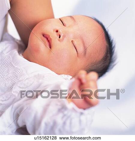 Mother holding baby boy, portrait, high angle view, Differential Focus View Large Photo Image Stock Photo - Mother holding baby boy, portrait, high angle view, Differential Focus. Fotosearch