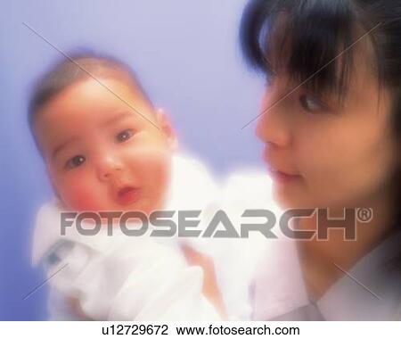 Mother with baby boy, portrait, front view, defocused View Large Photo Image Stock Image - Mother with baby boy, portrait, front view, defocused. Fotosearch