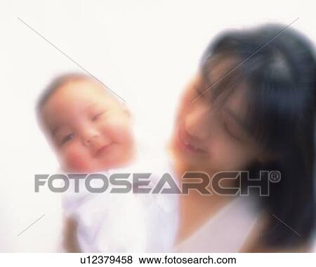 Mother with baby boy, portrait, front view, defocused View Large Photo Image Stock Photo - Mother with baby boy, portrait, front view, defocused. Fotosearch
