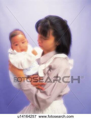 Mother with baby boy, portrait, front view, defocused View Large Photo Image Stock Photo - Mother with baby boy, portrait, front view, defocused. Fotosearch