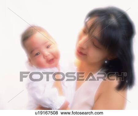 Mother with baby boy, portrait, front view, defocused View Large Photo Image Stock Photo - Mother with baby boy, portrait, front view, defocused. Fotosearch