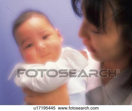 Mother with baby boy, portrait, front view, defocused View Large Photo Image Stock Photography - Mother with baby boy, portrait, front view, defocused. Fotosearch