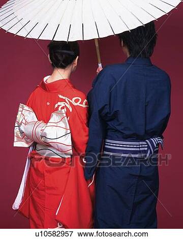 Stock Photo - A couple in kimono in a bangasa, Rear View. Fotosearch