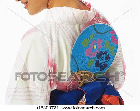 A fan put in the belt of the back of a woman's kimono, Rear View, Close Up View Large Photo Image Stock Image - A fan put in the belt of the back of a woman's kimono, Rear View, Close Up. Fotosearch