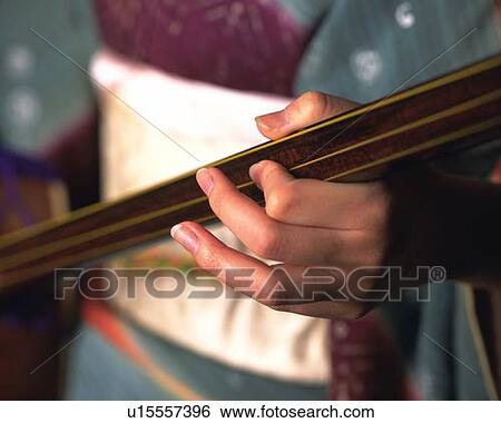 A hand of woman in kimono playing shamisen, High Angle View, Close Up, Differential Focus View Large Photo Image Stock Photograph - A hand of woman in kimono playing shamisen, High Angle View, Close Up, Differential Focus. Fotosearch
