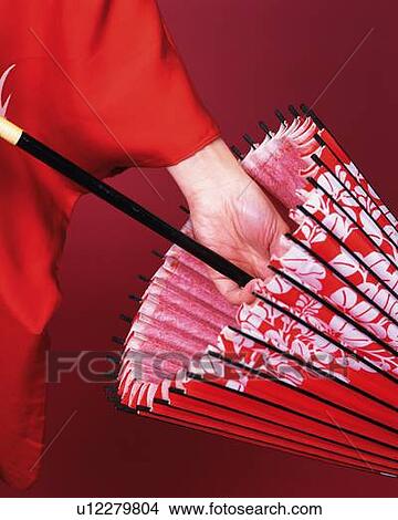 Picture - A woman in kimono holding a bangasa, Close Up. Fotosearch
