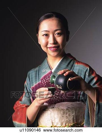 A woman in kimono with sake pot and cup, Front View View Large Photo Image Stock Photograph - A woman in kimono with sake pot and cup, Front View. Fotosearch