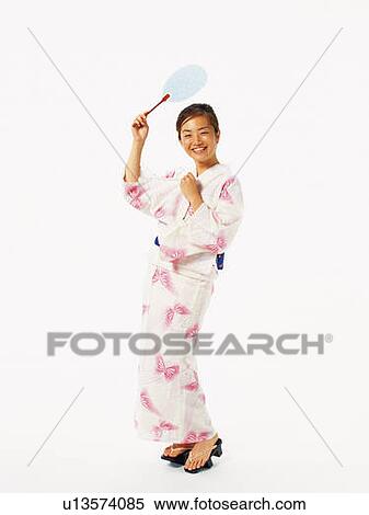 A woman in yukata smiling and posing, Front View View Large Photo Image Stock Photography - A woman in yukata smiling and posing, Front View. Fotosearch