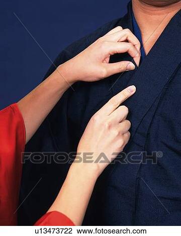 A woman's hand adjusting man's kimono, Close Up View Large Photo Image Stock Image - A woman's hand adjusting man's kimono, Close Up. Fotosearch